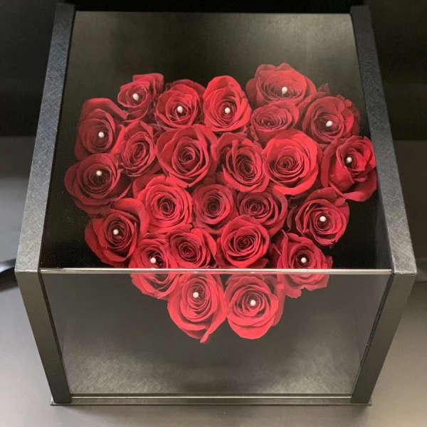 Heart-shaped box filled with red roses