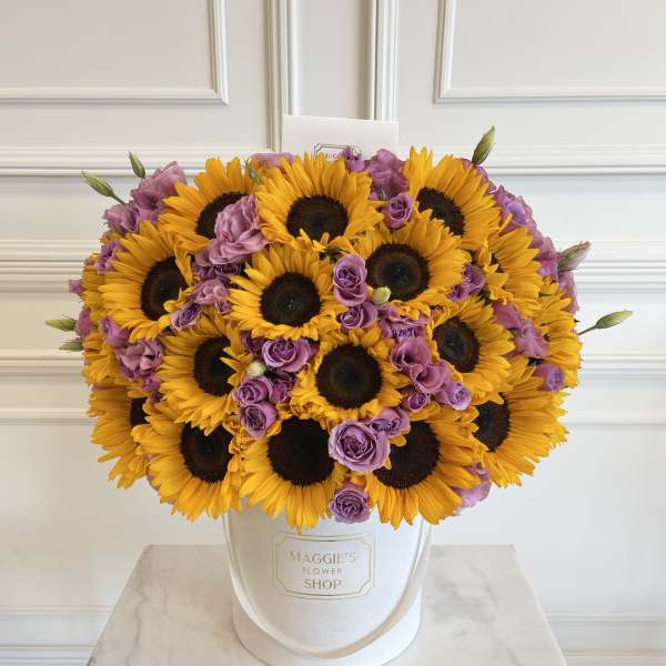 Sunflower and lavender rose bouquet in a white hat box