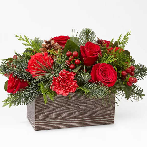 Red roses and carnations in a rectangular wooden box