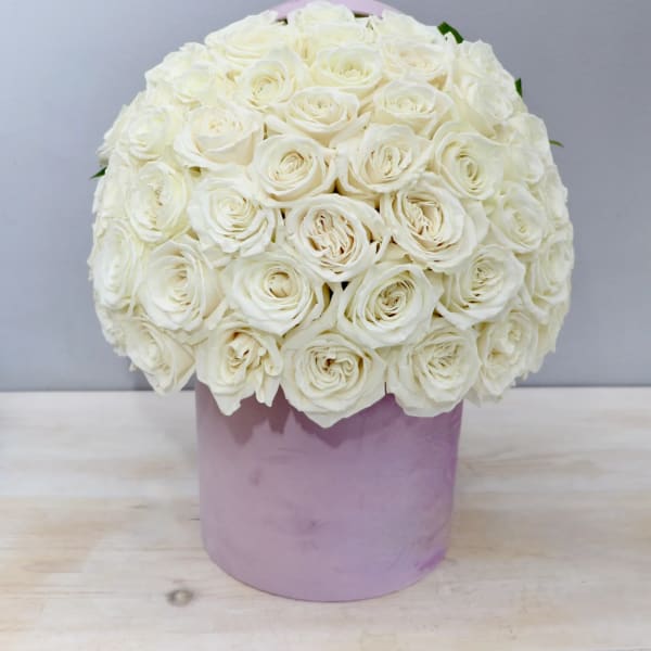 White rose bouquet in a lavender hatbox