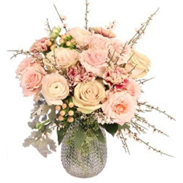Blush roses and carnations in a textured vase