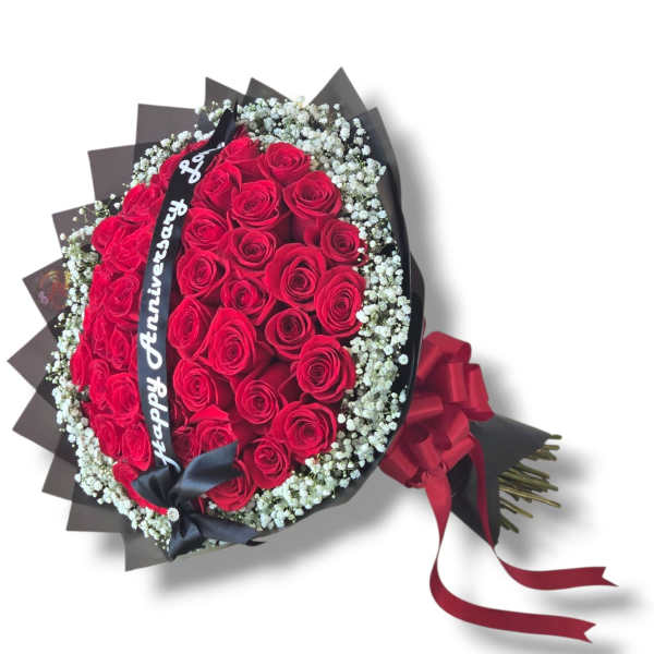 Bouquet of red roses with baby's breath and a ribbon