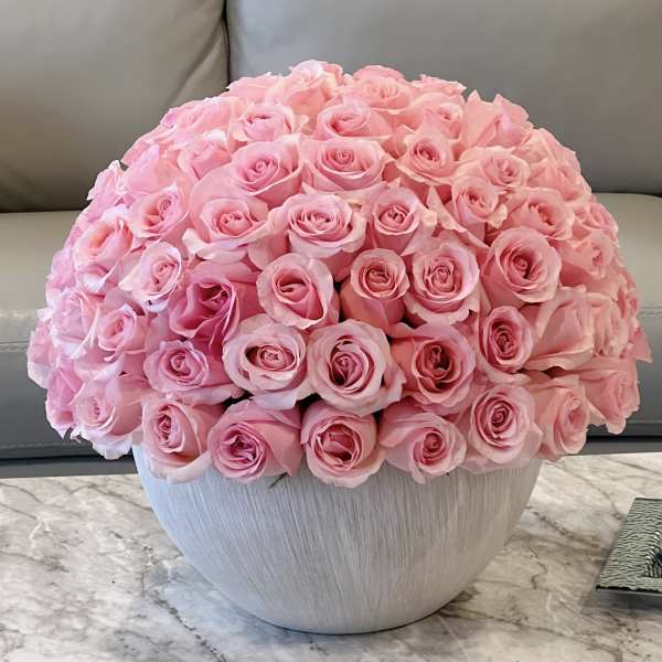 Large bouquet of pink roses in a white vase
