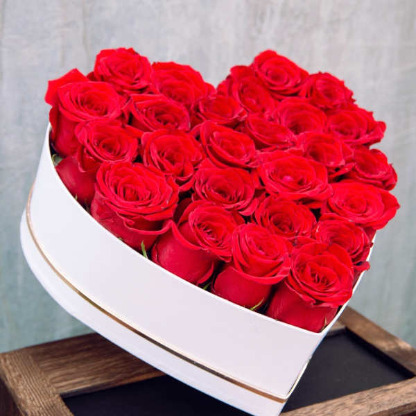 Heart-shaped box filled with red roses