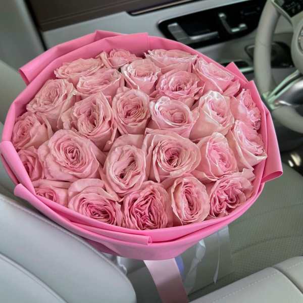 Bouquet of pink roses wrapped in pink paper