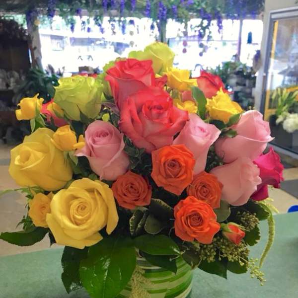 Colorful bouquet of roses in a glass vase