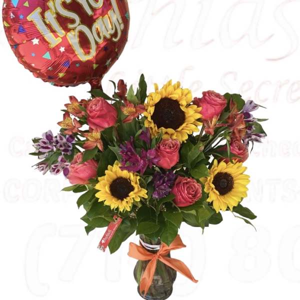 Bouquet of sunflowers, pink roses, and alstroemeria with a red "It's Your Day!" balloon