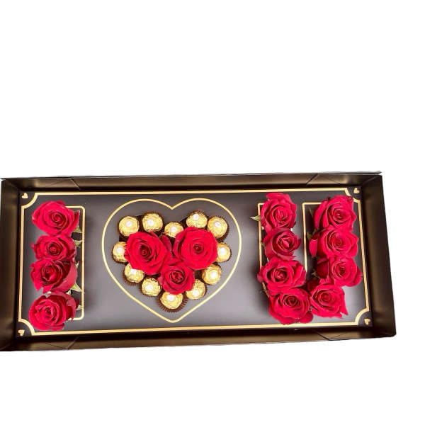 Rectangular gift box with red roses and chocolates arranged in an I love U design