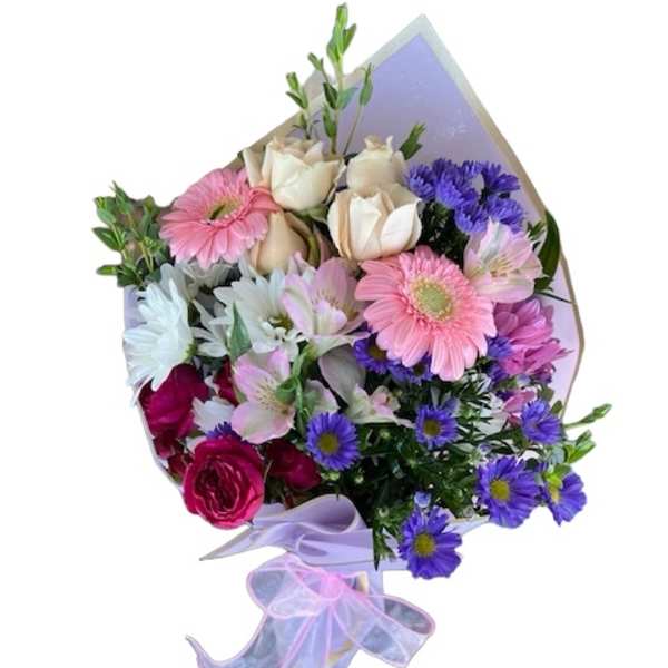 Bouquet of pink, white, and purple flowers wrapped in lavender paper