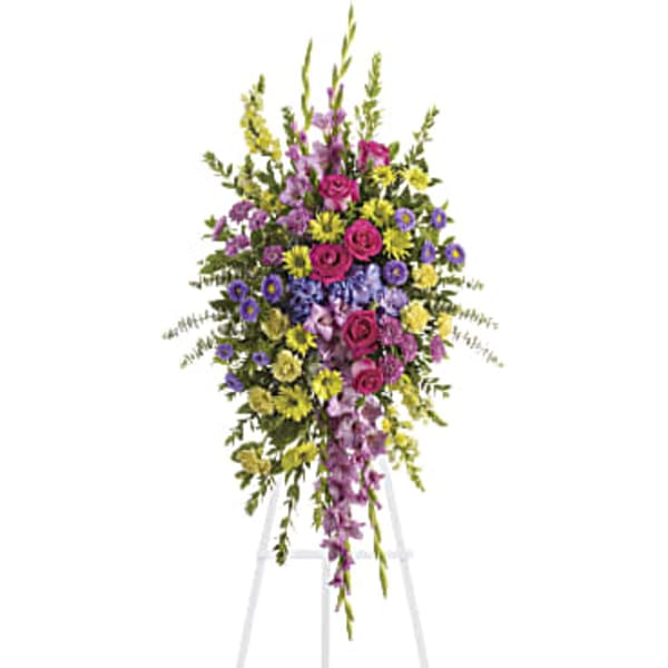 Tall standing floral spray with pink, purple, and yellow flowers