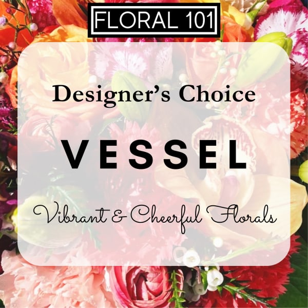 Designer choice floral vessel with vibrant mixed blooms