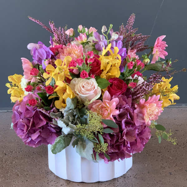 Colorful mixed bouquet in a white ribbed vase