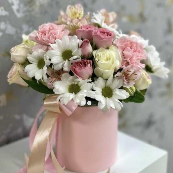 Pink and white bouquet in a pink hat box with ribbon