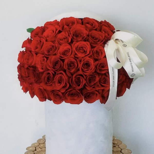 Large bouquet of red roses with a white ribbon