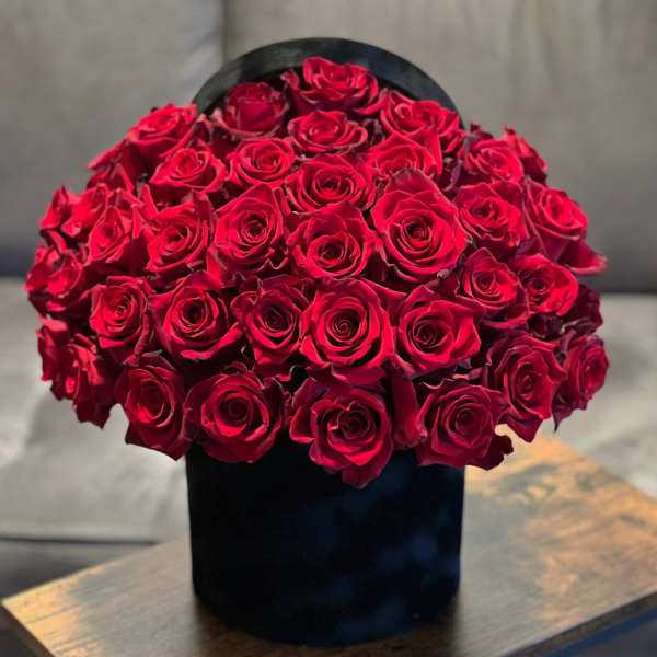 Large bouquet of red roses in a black box