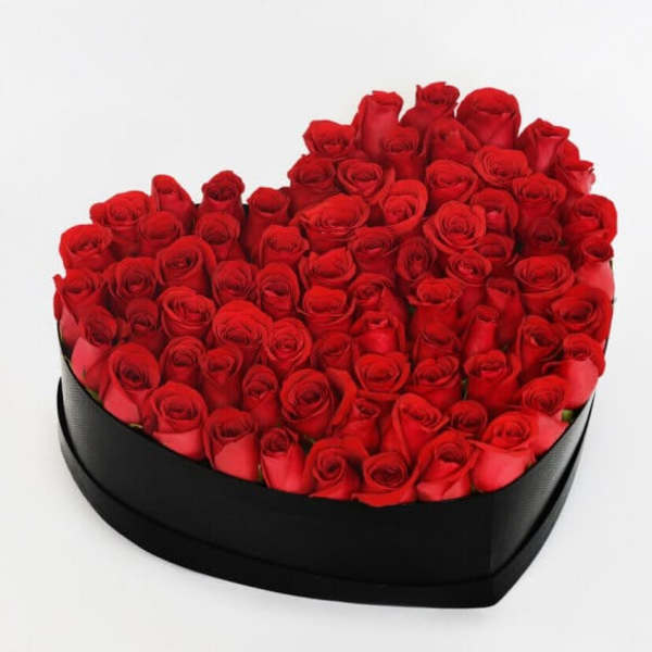 Heart-shaped box filled with red roses