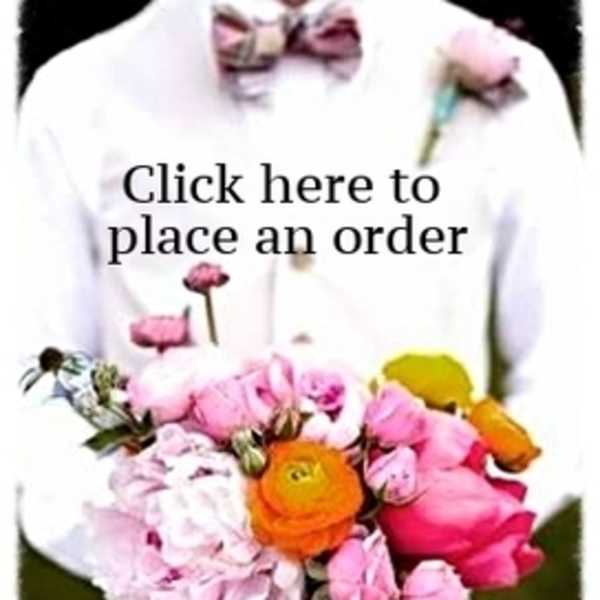 Person holding a bouquet of pink, orange, and yellow flowers