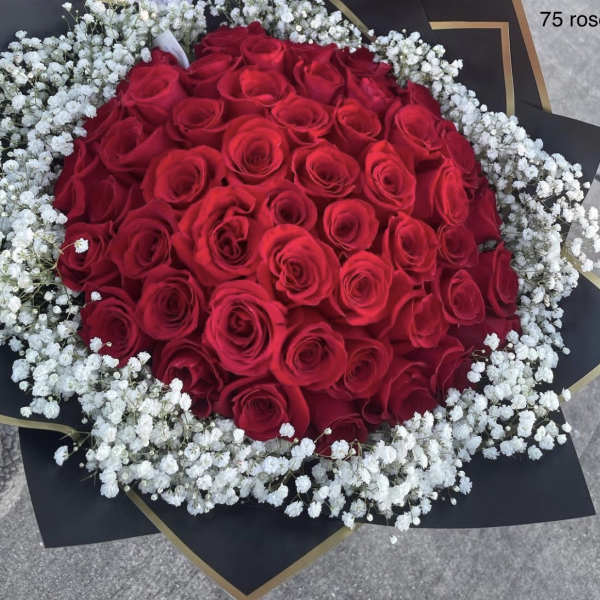 Large bouquet of red roses surrounded by white baby's breath