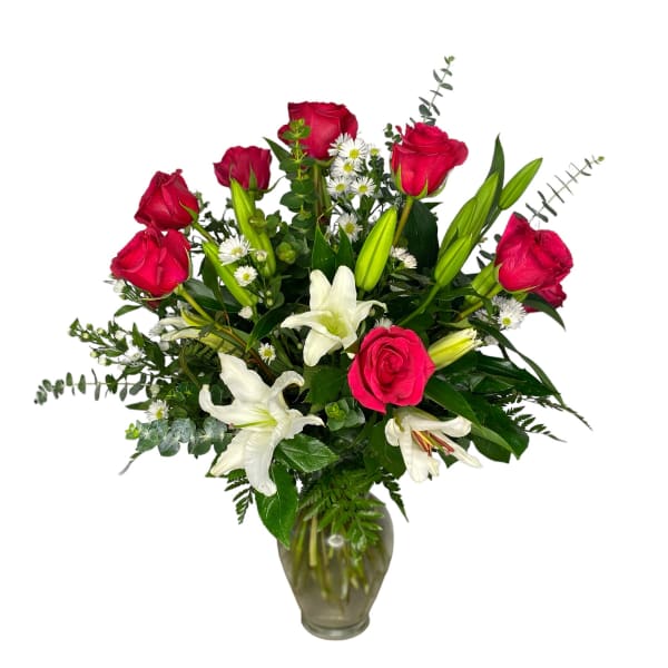 Red roses and white lilies in a glass vase