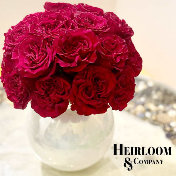 Bouquet of deep pink roses in a clear glass vase