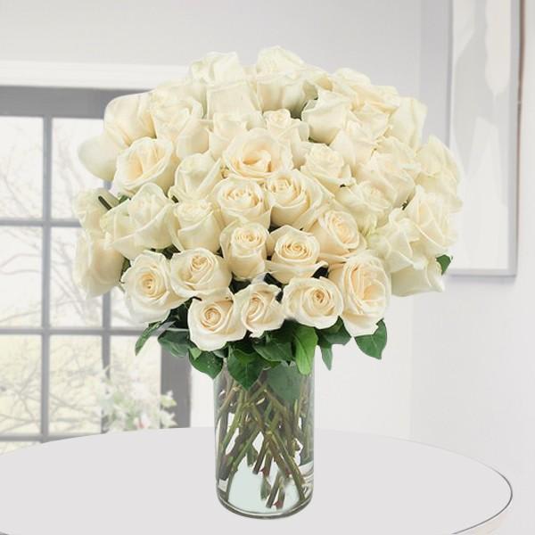 Bouquet of white roses in a clear glass vase