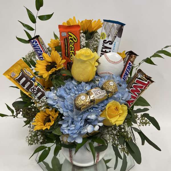 Bouquet of yellow roses and sunflowers with candy bars and a baseball