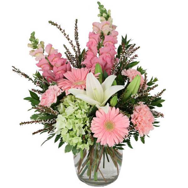 Pink and white mixed bouquet in a clear glass vase