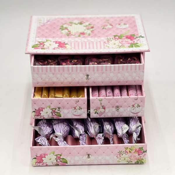 Pink floral gift box with drawers of wrapped chocolates