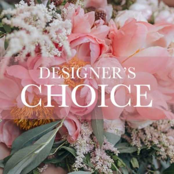 Pink floral arrangement with large blooms and white filler flowers