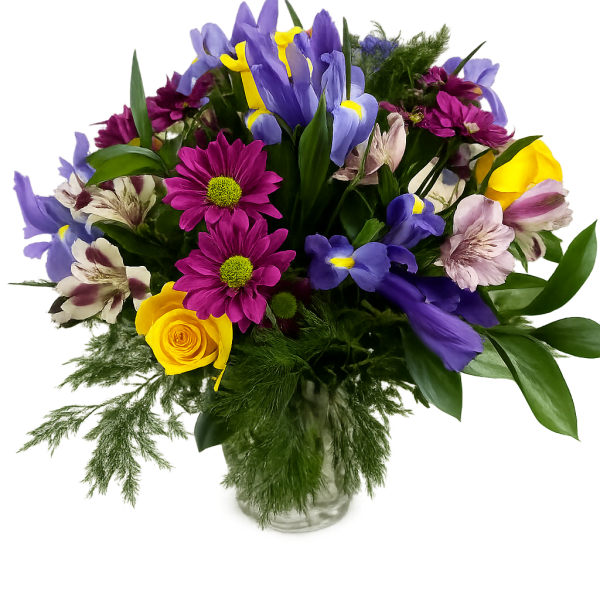 Mixed bouquet with purple irises, yellow roses, and magenta daisies in a glass vase