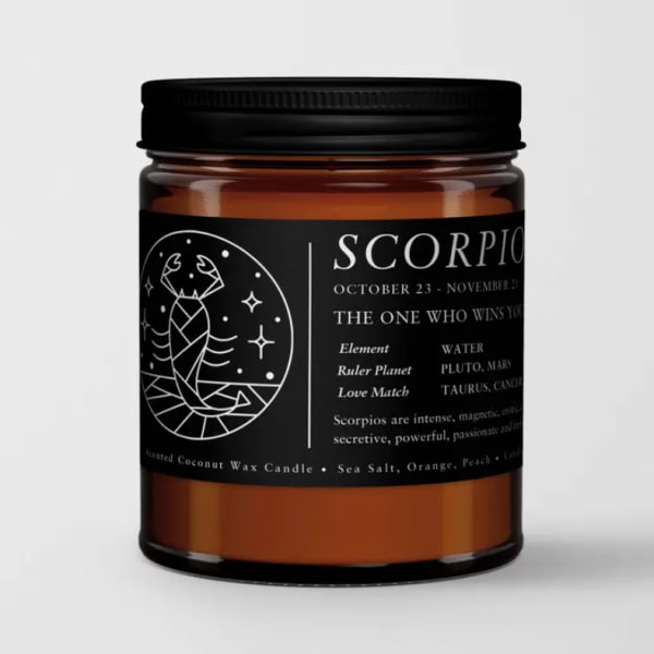 Amber candle in a black-lidded jar with Scorpio label