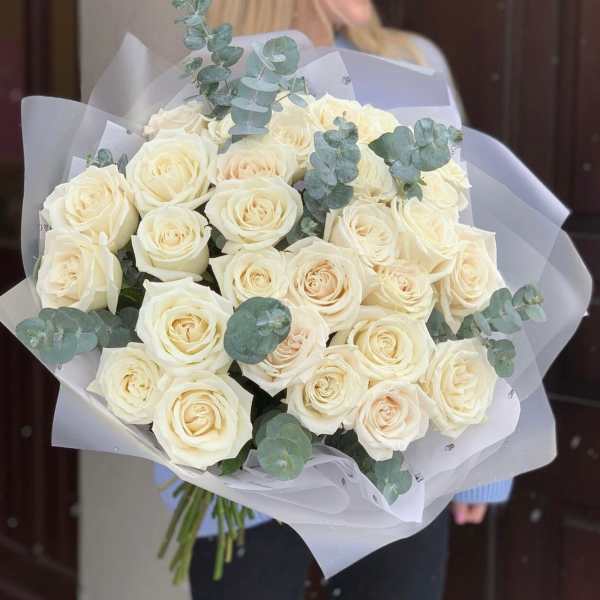 Bouquet of cream roses with eucalyptus in white wrap