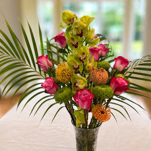 Featuring...The Cymbidium Orchid, with roses and mixed seasonal flowers