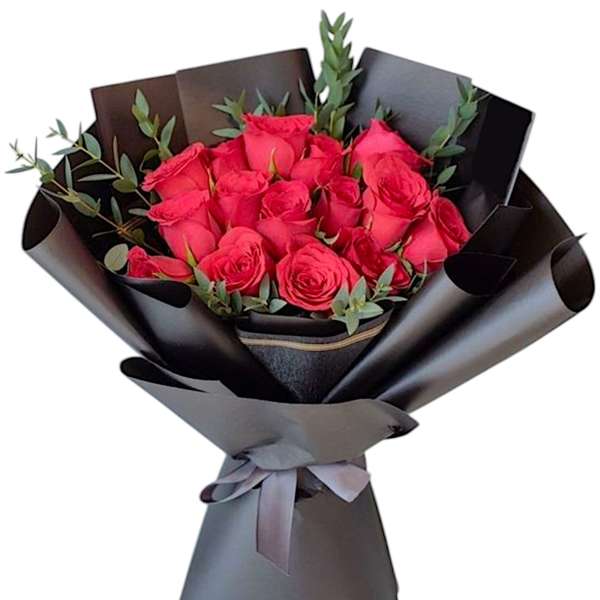 Bouquet of pink roses wrapped in black paper