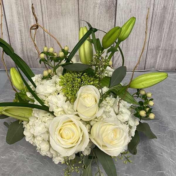White rose and lily bouquet with hydrangeas and greenery