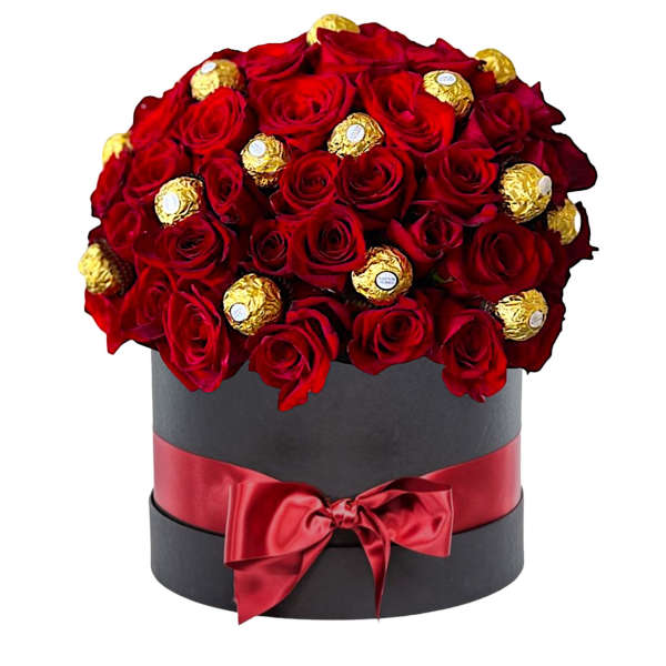 Red roses and gold-wrapped chocolates in a black hat box with a red ribbon