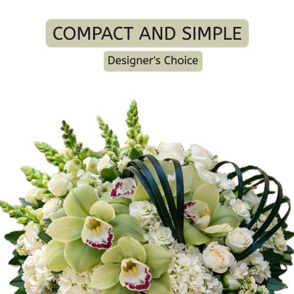 Compact white and green floral arrangement with orchids and roses