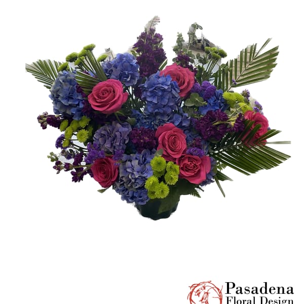 Bouquet of pink roses and blue hydrangeas with purple accents