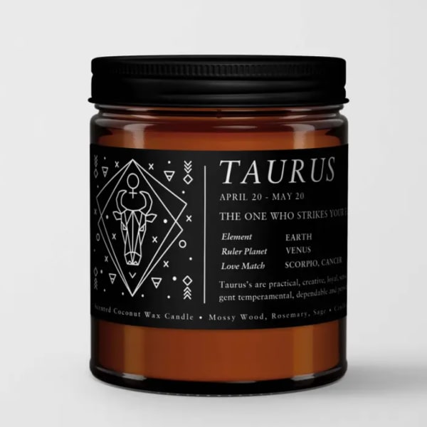 Black-labeled Taurus candle in an amber glass jar