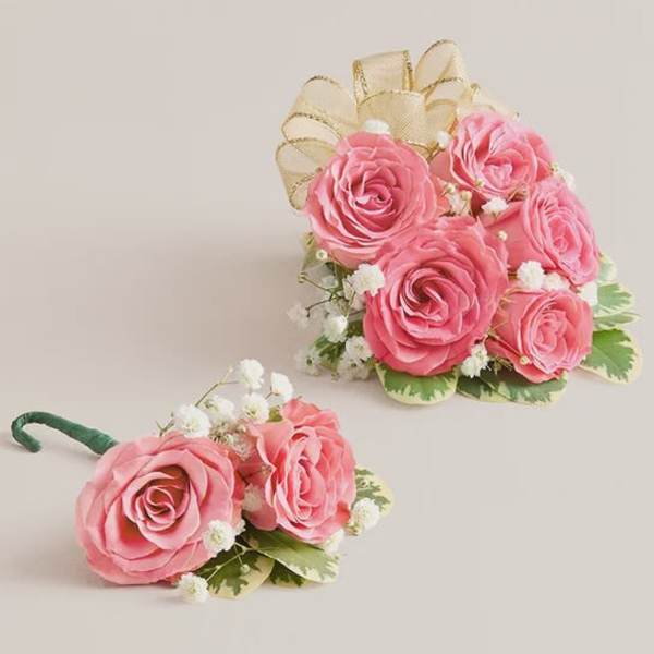 Pink rose bouquet and matching boutonniere with white filler flowers