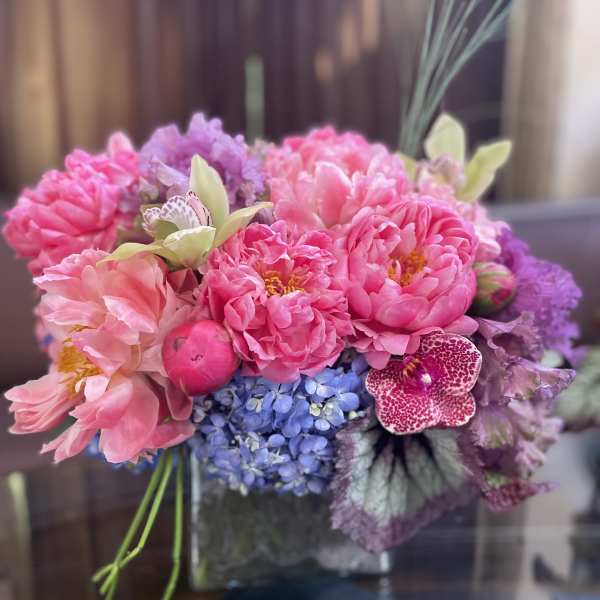 Pink and purple bouquet in a glass vase