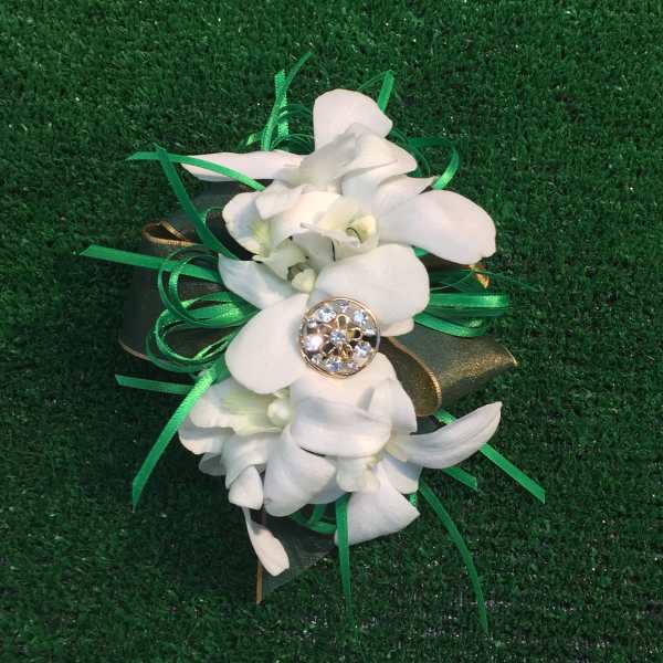 White orchid corsage with green ribbon and jeweled center