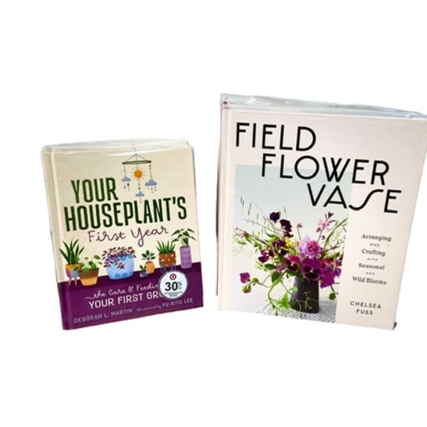 Two gardening books with plant and flower covers on a white background