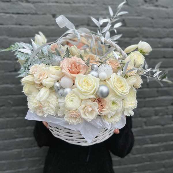 Cream and blush bouquet in a white basket with silver accents