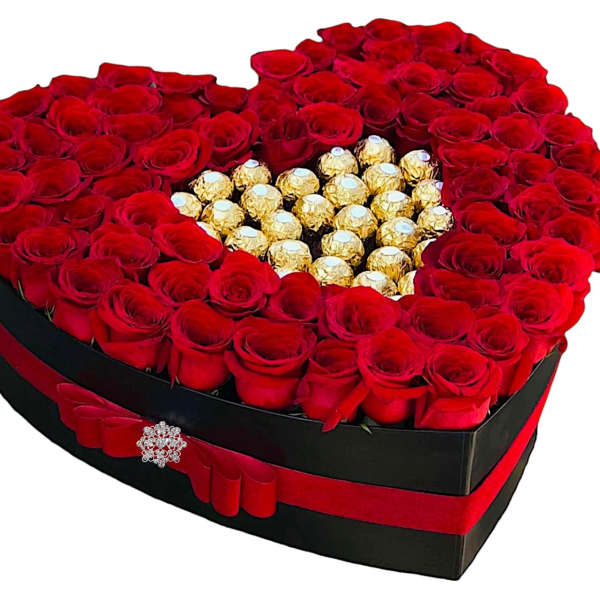 Heart-shaped box of red roses with gold-wrapped chocolates in the center