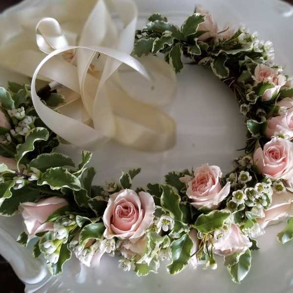 Pink rose floral wreath with white ribbon