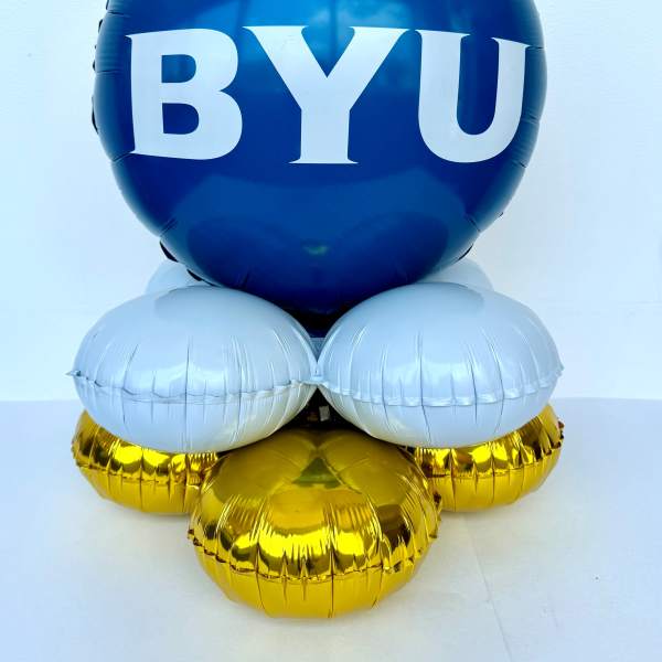 Blue BYU balloon arrangement with white and gold balloons