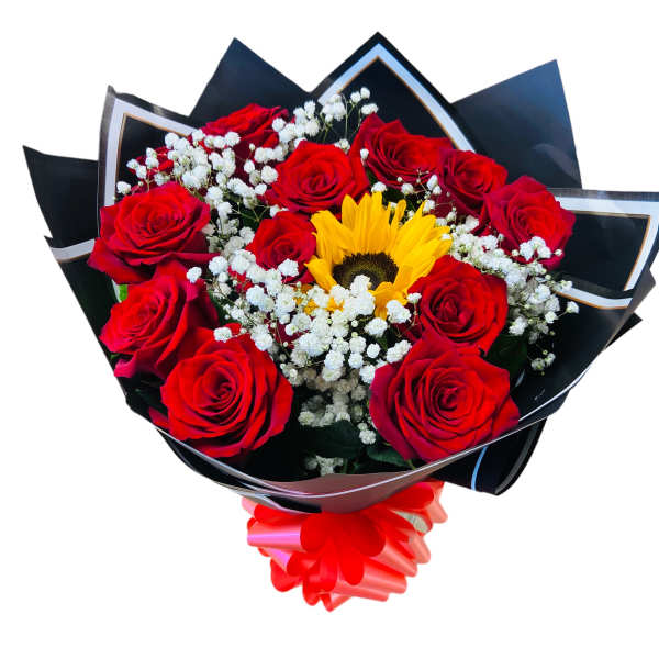 Bouquet of red roses with a yellow sunflower and white baby's breath