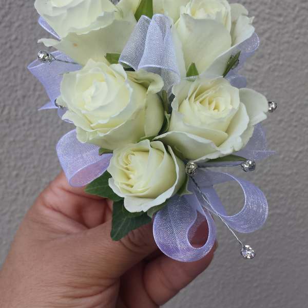 Small bouquet of white roses with lavender ribbon and crystal picks