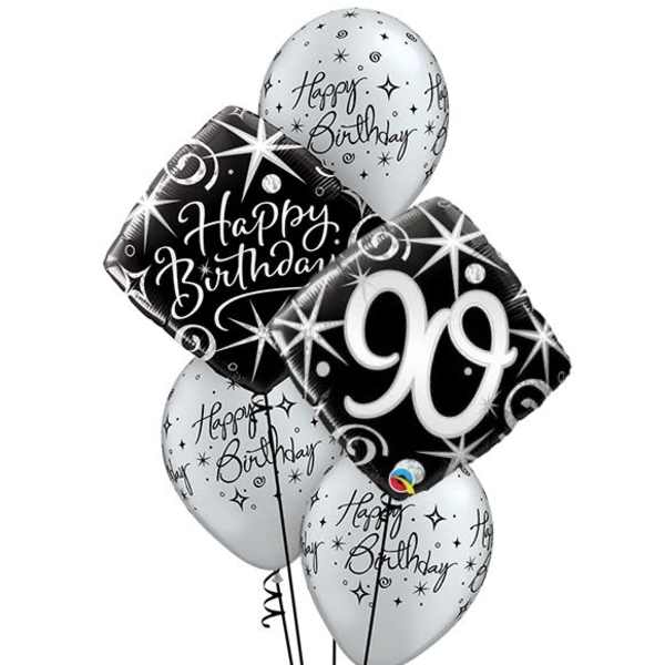 Cluster of birthday balloons with a large black "90" balloon